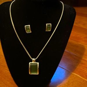 Silver plated necklace with green pendant. Includes matching pierced earrings.